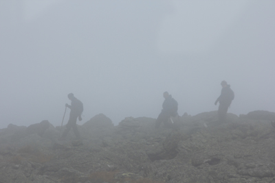 Trekkers in the fog on Mount Washington