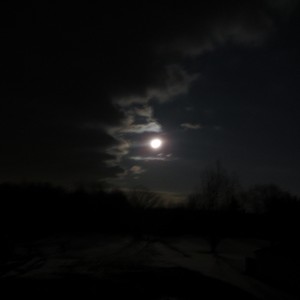 The moon continued shining even though the clouds had originally covered it